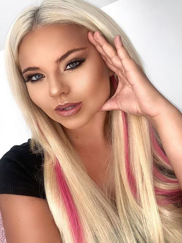 Apollonia Llewellyn wearing 20" Premium Exquisi Weft Hair Extensions Light Blonde with Pink Flash